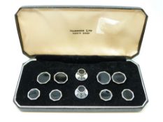 A cased Harrods stud,