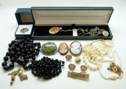 A large collection of costume jewellery to include faux pearls, brooches, chains,