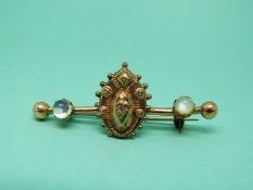 A Victorian brooch set with two moonstones