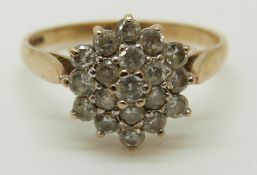 A 9ct gold ring set with cubic zirconia in a cluster, 2.