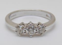 An 18ct white gold ring set with three diamonds, total 0.5ct, 3.