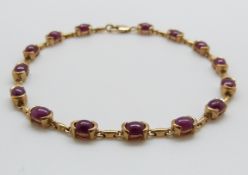 A 9ct gold bracelet set with rubies
