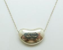 A Tiffany & Co silver necklace by Elsa Peretti in the bean design