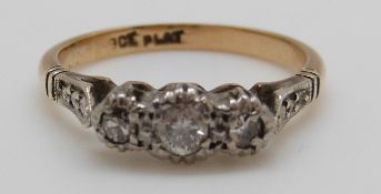 An 18ct gold ring set with three diamonds in a platinum setting, 2.