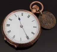 A 9ct gold ladies pocket watch with Roman numerals, blued hands and white enamel dial,