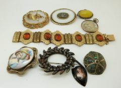 Two Victorian brooches, a Victorian gilt bracelet with foliate detail set with citrines,
