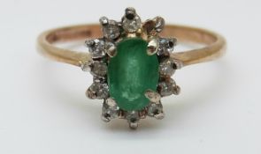 A 9ct gold ring set with an emeralds in a cluster