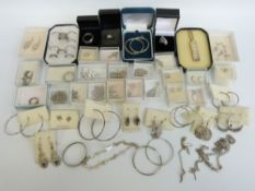 A large collection of silver jewellery including silver rings, silver earrings,