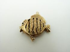A 9ct gold charm/ pendant in the form of a fish, 8.