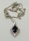 A 9ct white gold pendant set with a sapphire and diamonds on 9ct white gold chain, 1.