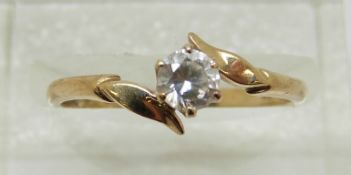 A 9ct gold ring set with a round cut cubic zirconia (size N)