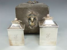 A pair of George III hallmarked silver tea caddies with flower finials in original two division