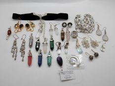 A moonstone necklace, four pairs of moonstone earrings, amber brooch, pearl earrings,