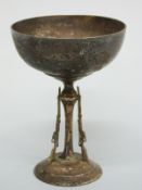 An Edward VII hallmarked silver shooting trophy formed as a bowl supported by three rifles marked