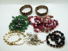 A silver 925 charm bracelet with 21 charms,