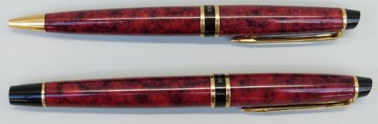 Waterman Phileas fountain and ballpoint pen set with red marbled barrel and caps,