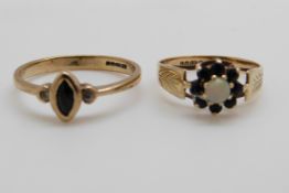 A 9ct gold ring set with a sapphire and two diamonds and a 9ct gold ring set with an opal