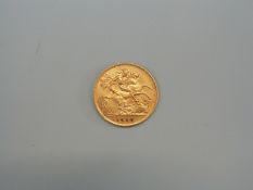 A 1910 gold half sovereign.