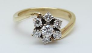 A 14ct gold ring set with diamonds in a cluster, total diamond weight approximately 0.