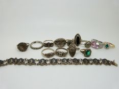 A quantity of silver rings to include marcasite set, a Siam bracelet and two 9ct gold silver rings.