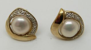 A pair of 9ct gold earrings set with pearls and diamonds