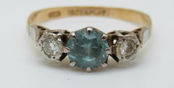 An 18ct gold ring set with a zircon and two diamonds in a platinum setting (size L)