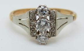 An 18ct gold ring set with diamonds in a platinum setting (size N)