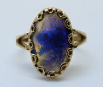 A 18ct gold ring set with a large oval opal cabochon (size M)