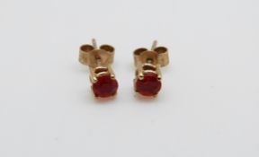 A pair of 9ct gold earrings set with fire opals