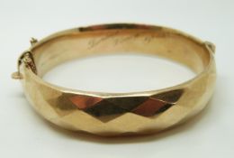 A 9ct gold faceted bangle, Chester 1961, 18.
