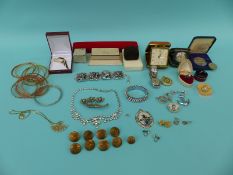 A collection of costume jewellery etc to include diamante military buttons, travelling clock,