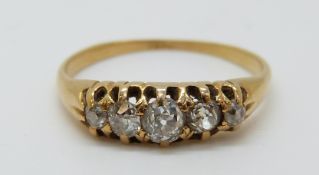 An 18ct gold ring set with five old cut diamonds (size M)