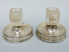 A pair of George V hallmarked silver and cut glass table match safes / lighters,