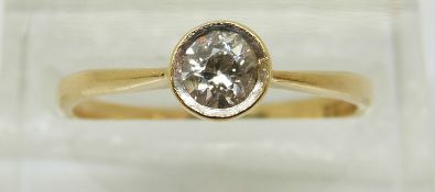 An 18ct gold ring set with a round cut diamond of approximately 0.22ct, 2.