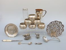 A Victorian hallmarked silver topped dressing table pot, six possibly white metal napkin rings,