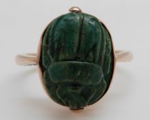A yellow metal Victorian ring set with a carved scarab beetle, 4.