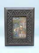 A framed Indian Moghul style miniature on paper of a couple on a balcony,