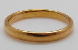 A 22ct gold wedding band, 4.