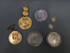 George II half crown brooch, together with two George II crowns,