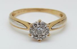A 18ct gold ring set with diamonds in a cluster, total 0.26ct, 2.