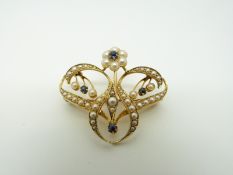 An Art Nouveau 15ct pendant/ brooch set with seed pearls and sapphires, 3.3 x 2.