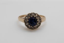 A 9ct gold set with a sapphire and paste (size N/O)