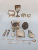 A 19th century hallmarked silver fiddle pattern fork, hallmarked silver cup, cigarette case,