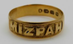 An 18ct gold ring reading 'Mizpah', 2.
