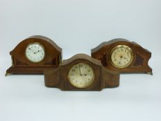 Three circa 1920's wooden cased mantel clocks, two with inlaid decoration,