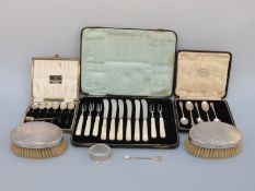 A cased set of six hallmarked silver coffee bean spoons, five further hallmarked silver teaspoons,