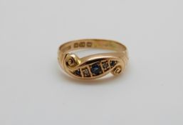 A late Victorian/ early Edwardian 18ct gold ring set with three sapphires and two diamonds, 2.