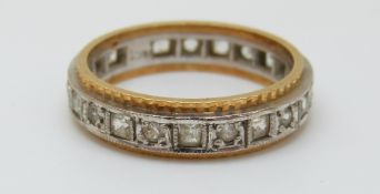An 18ct gold bi-coloured ring set with cubic zirconia (size N)