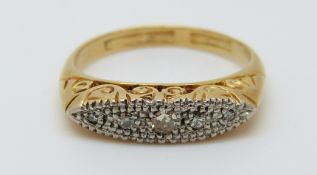 An 18ct gold ring set with diamonds in a platinum setting, 3.