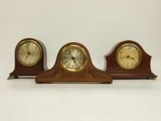 Three c1920's mantel clocks in mahogany cases with banded / string inlay decoration,